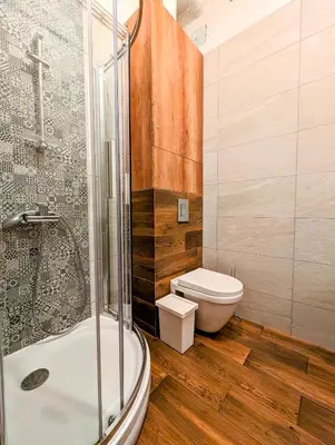 a bathroom with a shower and a toilet and a sink at Aleja Krasińskiego 24A by Homeprime in Kraków