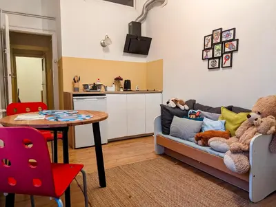 a living room with a couch and a table with stuffed animals at Aleja Krasińskiego 24A by Homeprime in Kraków