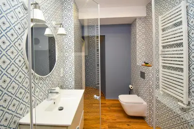 a bathroom with a white sink and a mirror at Sunny Corner in Kraków