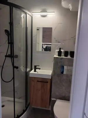 a bathroom with a shower and a sink and a shower at Apartamenty Marco 3-Bis- Przy Dworcu-Stare Miasto-Super Wi Fi in Kraków