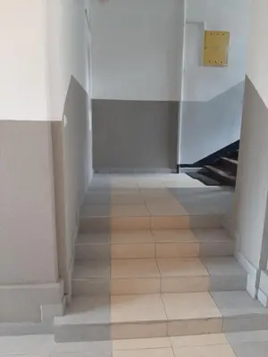 a hallway with a staircase with a white wall at Apartamenty Marco 3-Bis- Przy Dworcu-Stare Miasto-Super Wi Fi in Kraków