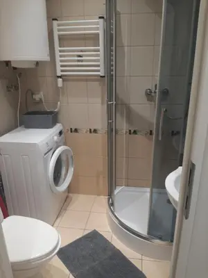 a bathroom with a shower and a toilet and a sink at Apartamenty Marco 3-Bis- Przy Dworcu-Stare Miasto-Super Wi Fi in Kraków