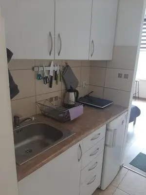a kitchen with a sink and white cabinets at Apartamenty Marco 3-Bis- Przy Dworcu-Stare Miasto-Super Wi Fi in Kraków