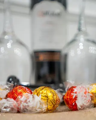 a group of candy wrapped in plastic on a table at Apartament z Jacuzzi Kraków SHADOW Zamoyskiego in Kraków