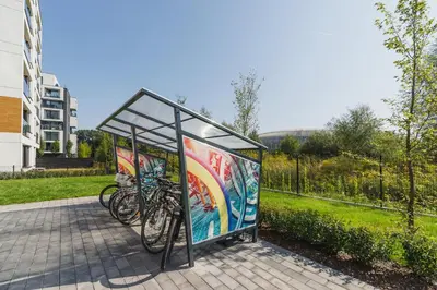 a bus stop with bikes parked in it at Dąbska Studio with Terrace & Parking by Noclegi Renters in Kraków