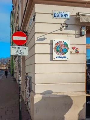 a street signs on the side of a building at Estery Studio Heart of Kazimierz in Kraków