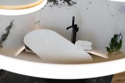 a bathroom with a white toilet in a sink at SPA bedrooms with Sauna&Bath and Free Parking in Kraków