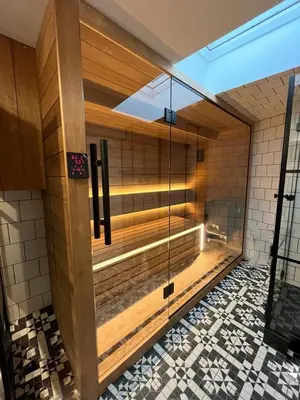 a sauna with a glass door in a building at Cracovia Luxury Bright Apartment Great Location Sauna in Kraków