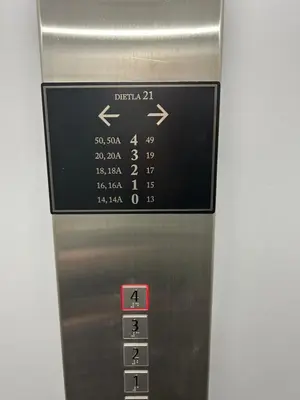 a elevator with a sign on the side of it at Cracovia Luxury Bright Apartment Great Location Sauna in Kraków