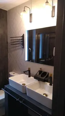 a bathroom with a white sink and a mirror at Zaciszny Zakątek Zawoja in Zawoja