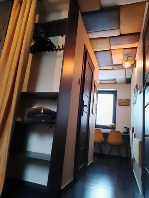 a hallway with a staircase in a room at Zaciszny Zakątek Zawoja in Zawoja