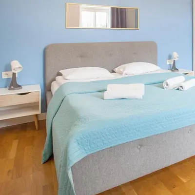 a bed with two pillows on it in a bedroom at Smart Old Town Apartment in Kraków