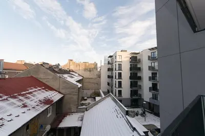 an overhead view of a city with snow covered buildings at Ghetto Heroes Square Lwowska 10 A/C p4you pl in Kraków