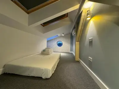 a bedroom with a bed in a room at Balcony Bliss Main Square Loft in Kraków