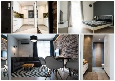 a kitchen and a living room with a brick wall at Apartament nad Wisłą, bezpłatny parking, AWG APARTMENTS in Kraków