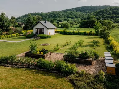 an aerial view of a garden with a house at Domek GORCZAŃSKA KOLIBA w Gorcach in Kamienica