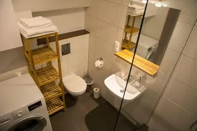 a small bathroom with a toilet and a sink at Kompleksowo wyposażony apartament w centrum in Kraków