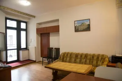 a living room with a couch and a table at Kompleksowo wyposażony apartament w centrum in Kraków