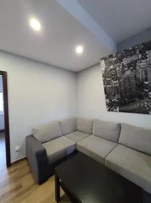 a living room with a couch and a coffee table at Domek Bocianie Gniazdo in Stradomka