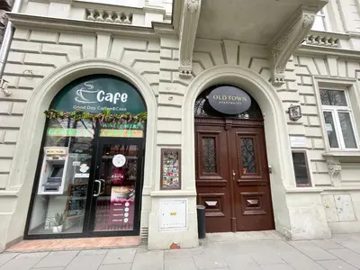 a store with two large doors in a building at Gertrudy 10 Residence - 1-Minute Walk to the Old Town in Kraków