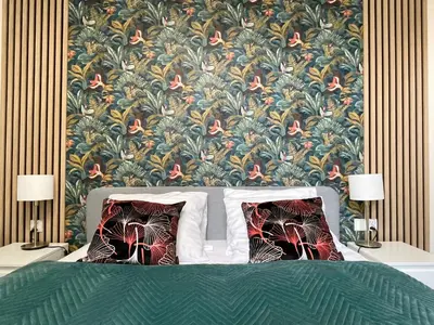a bedroom with a bed with a floral wallpaper at Gertrudy 10 Residence - 1-Minute Walk to the Old Town in Kraków