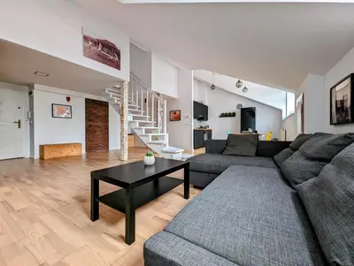a living room with a couch and a table at Starowiślna 34 by Homeprime in Kraków