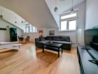 a living room with a couch and a table at Starowiślna 34 by Homeprime in Kraków