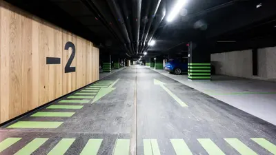 a parking garage with a number on the wall at Native Apartments Kościuszki 39/22 in Kraków