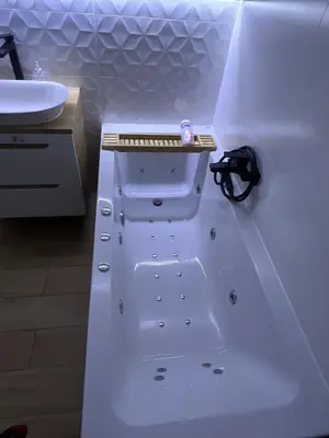 a white bathroom with a sink and a white tub at Cosy 3 room apartment close to Main Square in Kraków