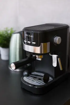a coffee maker sitting on top of a table at D21 Art Loft Apartment in Kraków