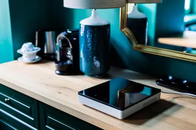 a electronic device sitting on a wooden counter in a room at Green Gertrudy in Kraków