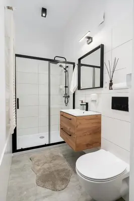 a bathroom with a toilet and a sink and a shower at Cracow Best Location Apartment No:6 by Cozyplace in Kraków