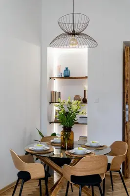a dining room with a table and chairs at Cracow Best Location Apartment No:6 by Cozyplace in Kraków