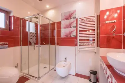 a bathroom with a shower and a sink at Hotel Karolek in Zawoja