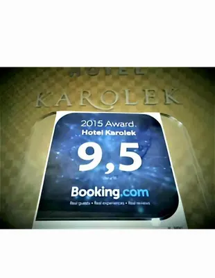 a sign for a hotel with the words on it at Hotel Karolek in Zawoja