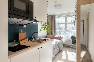 a kitchen with a sink and a counter top at MILESTONE Krakow Center Student Living by Tribera in Kraków