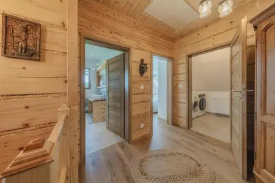 a hallway of a log cabin with wooden walls at Leśny Zakątek Jurków in Jurków