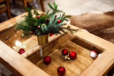 a table with a christmas tree and decorations on it at Leśny Zakątek Jurków in Jurków