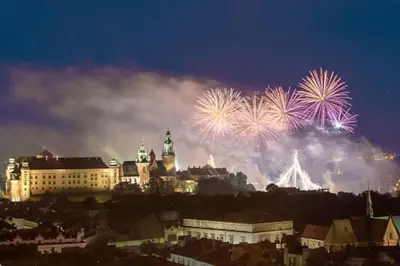 a city with fireworks exploding in the sky at Your stylish spot in the center of Kraków in Kraków