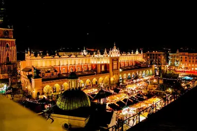 a view of a city at night with lights at Your stylish spot in the center of Kraków in Kraków