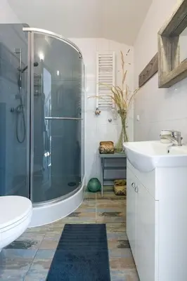 a bathroom with a shower and a toilet and a sink at Your stylish spot in the center of Kraków in Kraków