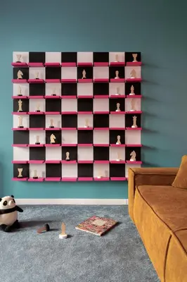 a room with a wall with pink and black boxes at Krakowiaki in Kraków