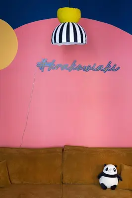 a teddy bear sitting on top of a couch at Krakowiaki in Kraków