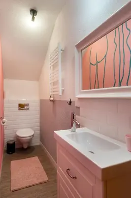 a bathroom with a sink and a toilet at Krakowiaki in Kraków