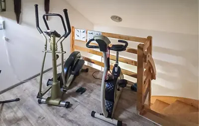 a group of exercise bikes in a room at Pet Friendly Apartment In Spytkowice in Spytkowice