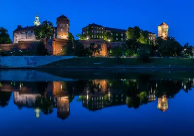 a view of the city at night at Old Town Apartment Kazimierz in Kraków