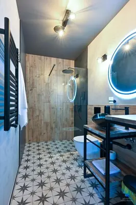 a bathroom with a toilet and a sink and a tub at Aparthotel Mamma Mia - Oświęcim in Oświęcim