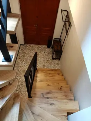a staircase in a house with wooden floors at Apartments in the heart of the city in Kraków