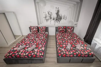a bedroom with a bed and a couch in it at 70s Business Room in Kraków