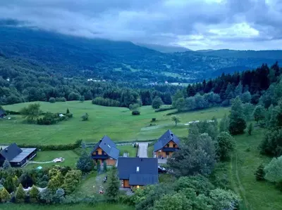 an aerial view of a house in a green field at Panorama Sucha Góra in Skawica